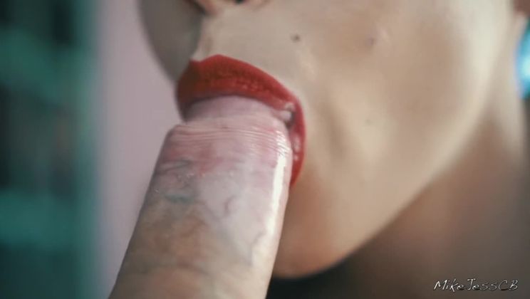 Girl with red lipstick pumps cock in her mouth